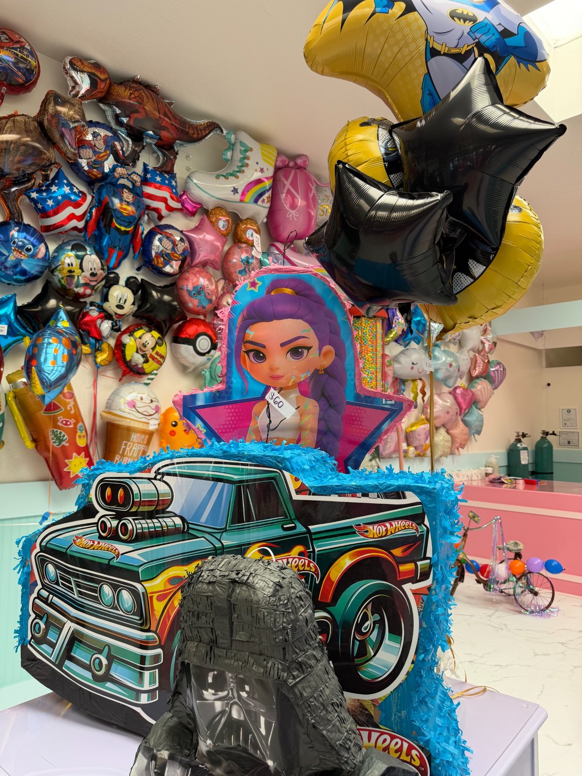 Hot Wheels piñata with character balloons