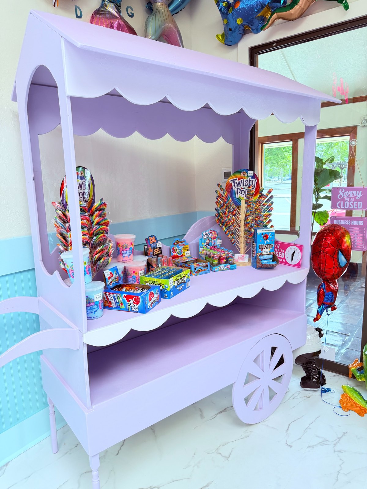 Wide view of candy cart and treats