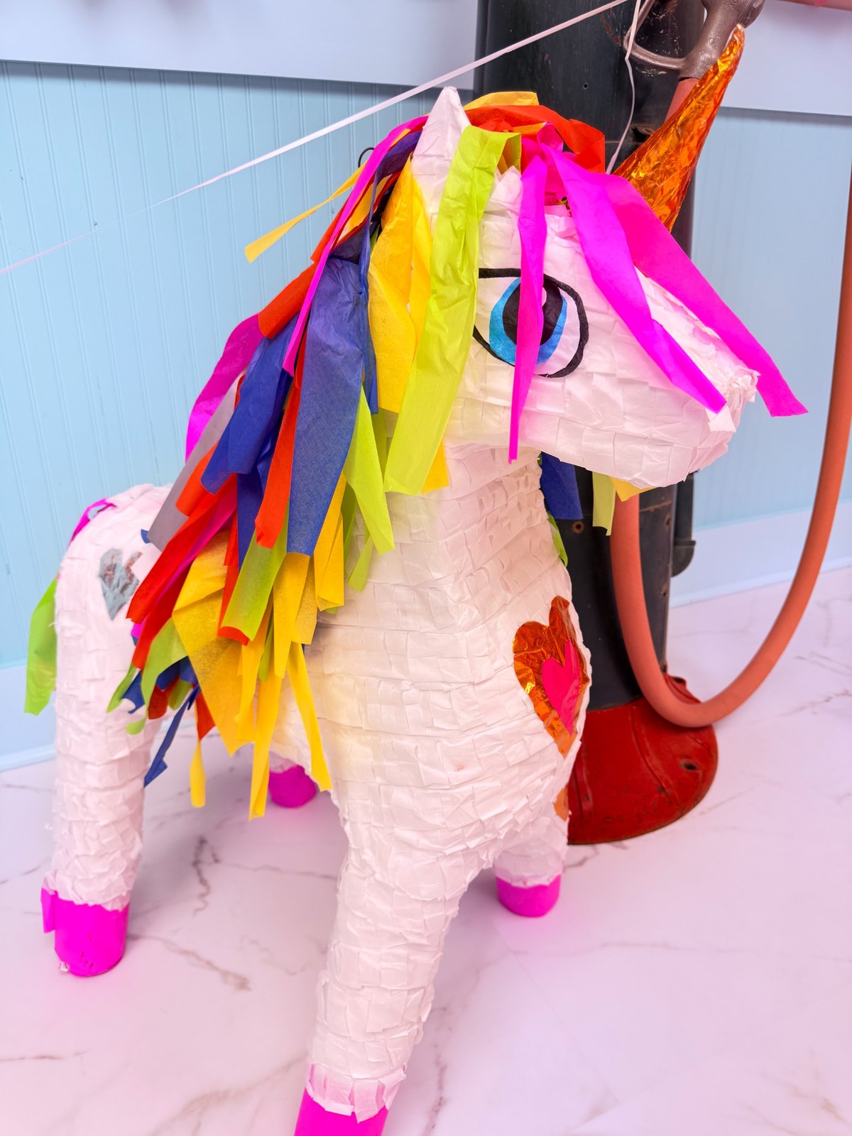 Unicorn piñata with rainbow mane